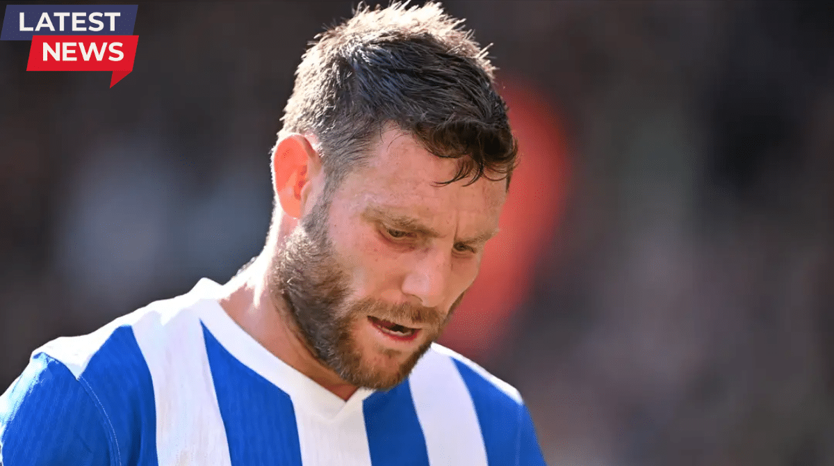 Close-up of a professional footballer in a blue and white striped jersey looking focused during a match, with a blurred stadium background.Close-up of a professional footballer in a blue and white striped jersey looking focused during a match, with a blurred stadium background.