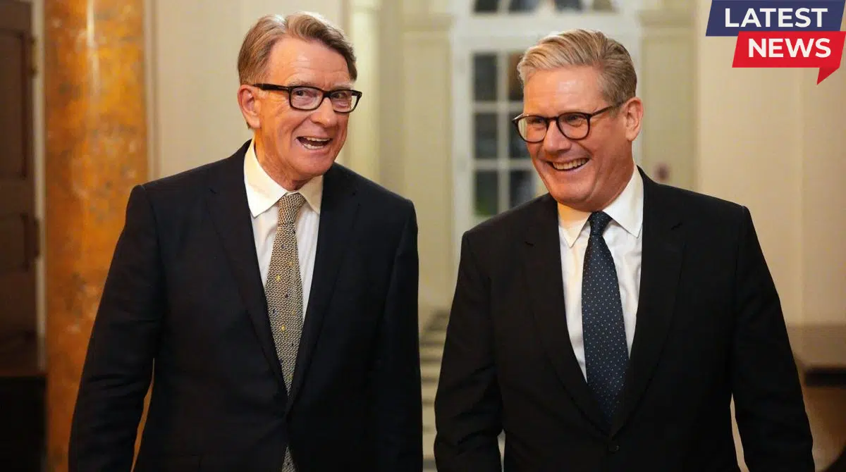 Keir Starmer and Peter Mandelson smiling and walking together during a formal political event indoors.