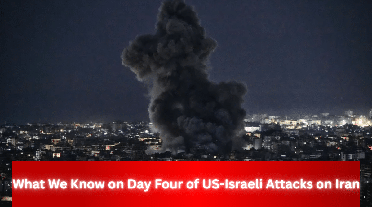 Large plume of dark smoke rising over a city at night, with headline text reading “What We Know on Day Four of US-Israeli Attacks on Iran.”