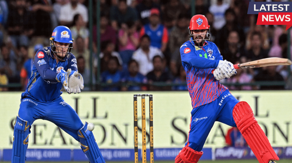 Delhi Capitals batsman plays a powerful shot while Mumbai Indians wicketkeeper prepares behind the stumps during IPL match