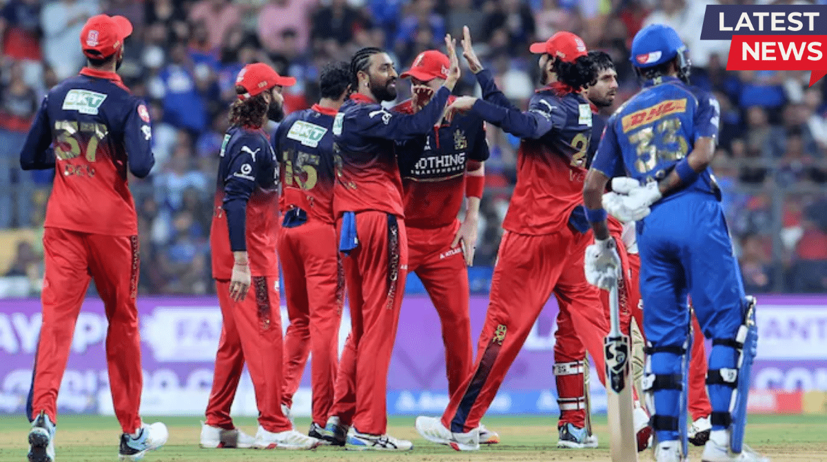 Royal Challengers Bengaluru players celebrating a wicket during an IPL match against Mumbai Indians while a batsman from the opposing team walks away.