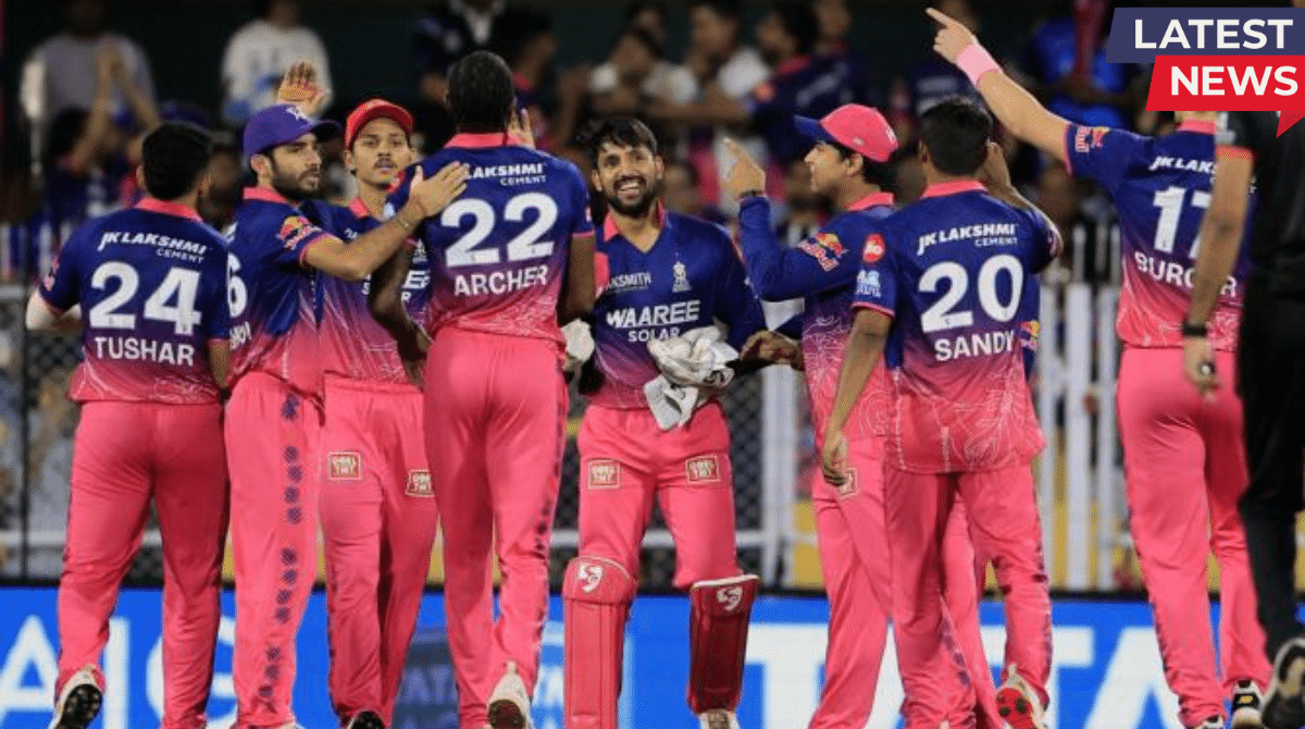 A group of Rajasthan Royals cricketers in their pink and blue jerseys celebrating on the field during an IPL match.